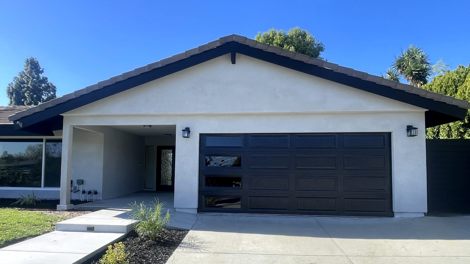 Newly installed dark brown garage door on a Southern California home